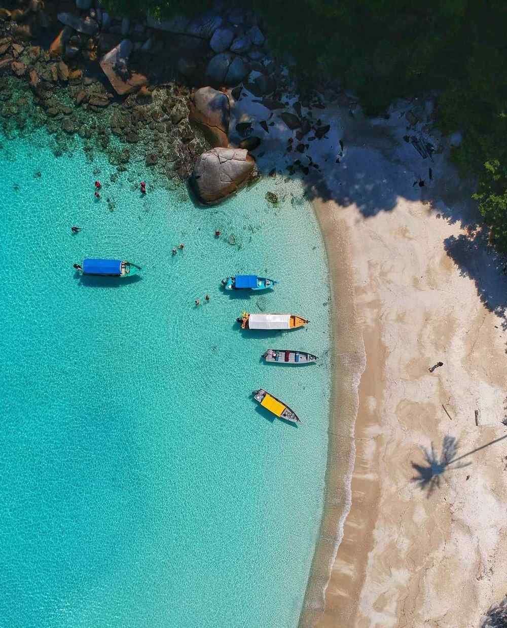 Local guide arranging a boat trip on Nemberala beach, Rote Island